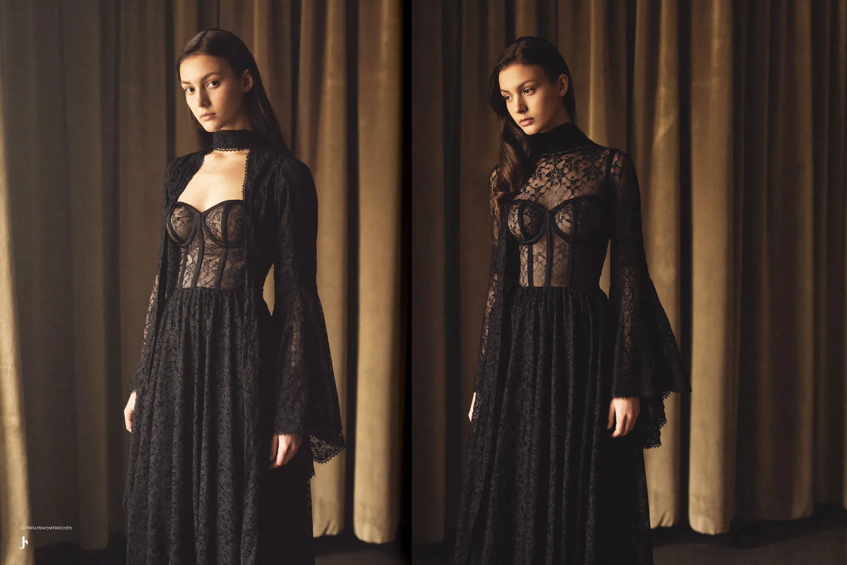 Long black lace gothic dresses with corseted bodices and bell sleeves in dramatic side light