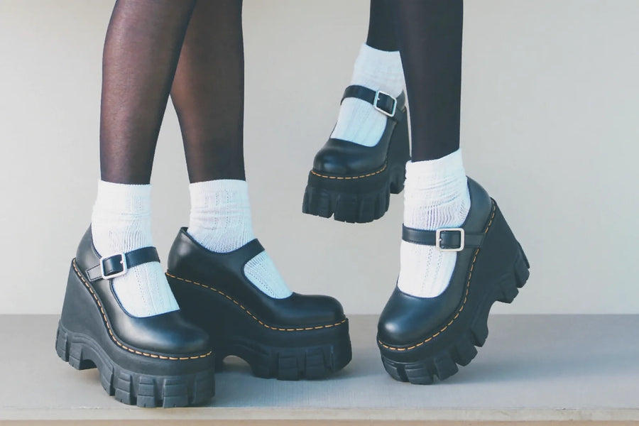 Black chunky platform Mary Jane shoes worn with white lace socks and black tights